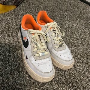 White, orange and black Nikes